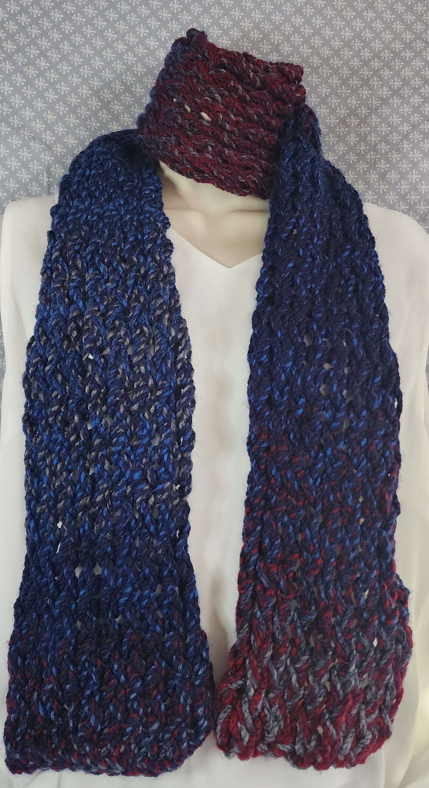 Finger Knitted Scarf | Keep warm in with this cozy red and blue scarf.